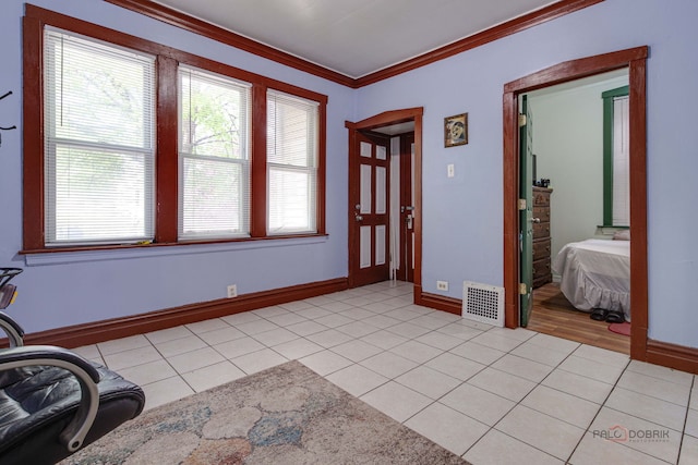 3117 S 53rd Ave, Cicero, IL 60804 - foyer entrance with crown molding, light tile patterned floors, and baseboards