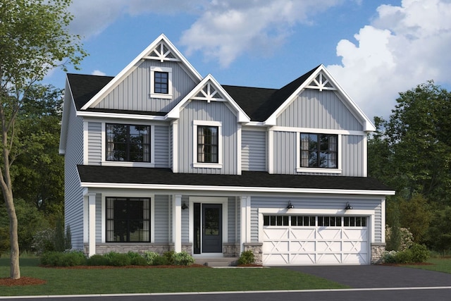 view of front of home with board and batten siding, a front yard, an attached garage, and stone siding