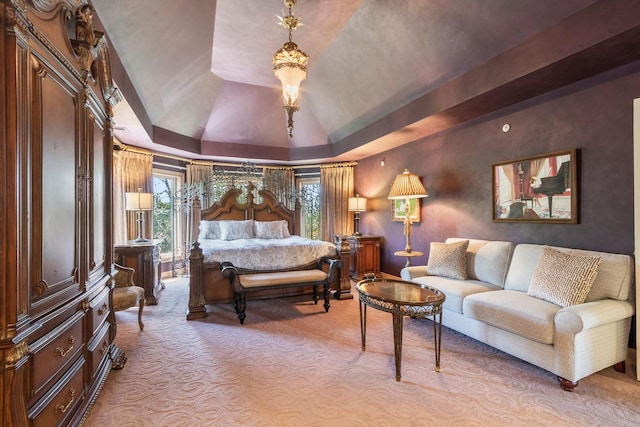 bedroom featuring carpet flooring, a tray ceiling, and vaulted ceiling