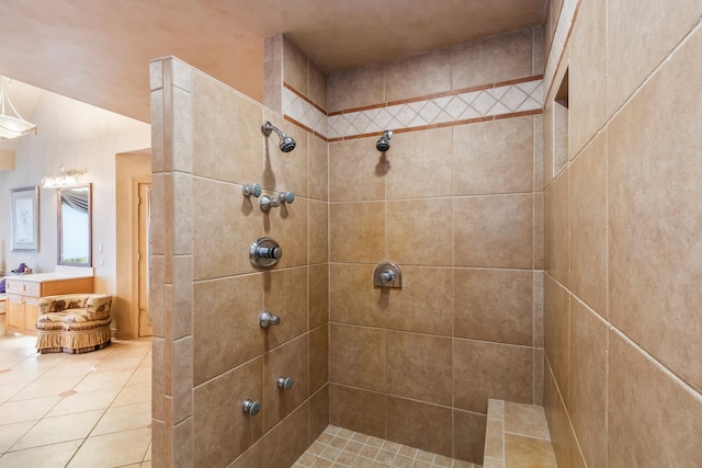 bathroom featuring tiled shower and tile patterned floors