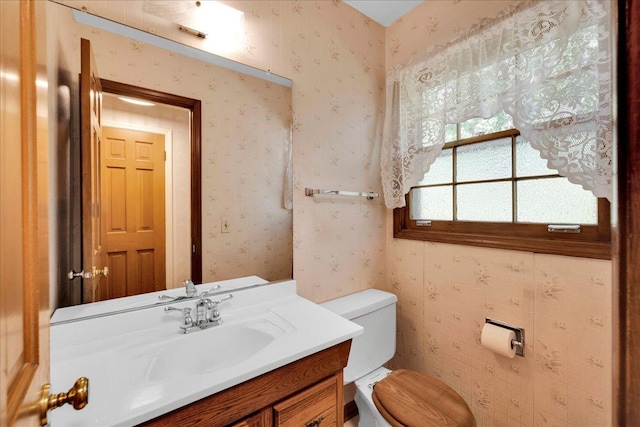26W266 Tomahawk Dr, Wheaton, IL 60189 - half bath with toilet, wallpapered walls, and vanity