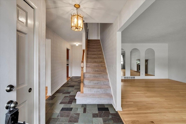26W266 Tomahawk Dr, Wheaton, IL 60189 - entrance foyer with stairway, wallpapered walls, a chandelier, and baseboards