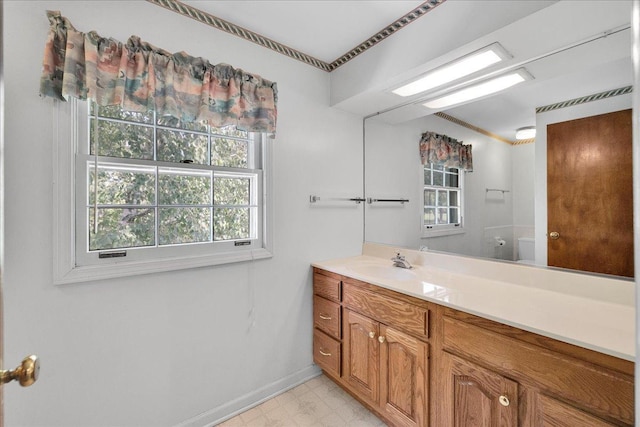 26W266 Tomahawk Dr, Wheaton, IL 60189 - bathroom with vanity, baseboards, toilet, and ornamental molding