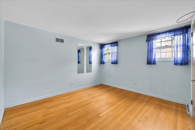 26W266 Tomahawk Dr, Wheaton, IL 60189 - spare room featuring light wood-style flooring and baseboards