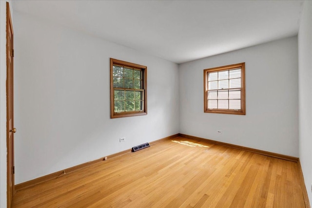 26W266 Tomahawk Dr, Wheaton, IL 60189 - unfurnished room with wood finished floors and baseboards