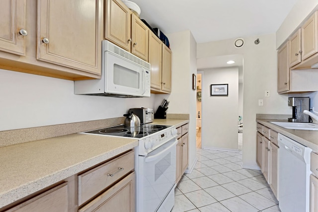 70 W Huron St Unit 2609, Chicago, IL 60654 - kitchen featuring white appliances, a sink, light brown cabinets, light countertops, and recessed lighting