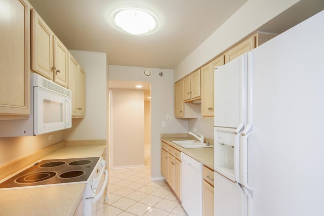 kitchen featuring light countertops, light tile patterned flooring, a sink, and white appliances