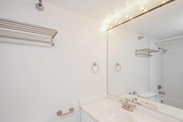 full bathroom featuring toilet, vanity, and shower / bathing tub combination