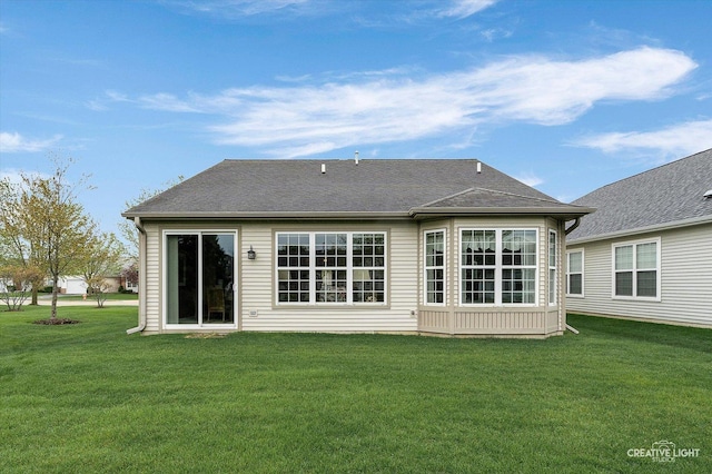 back of house with a yard