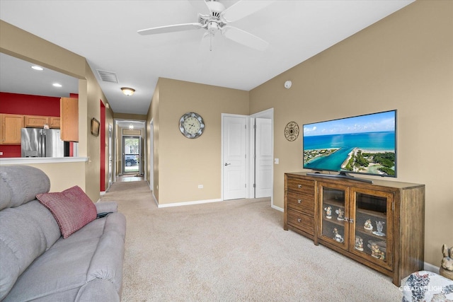 living area with ceiling fan, visible vents, light colored carpet, baseboards, and recessed lighting