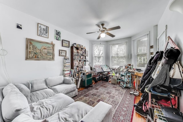 interior space featuring wood finished floors and a ceiling fan