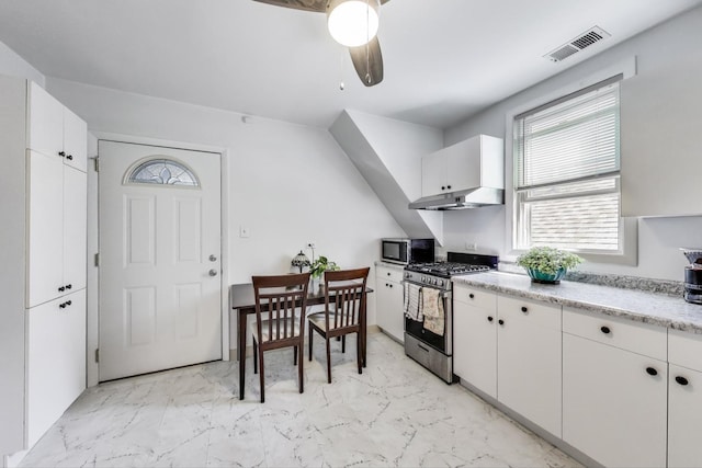 kitchen with stainless steel appliances, marble finish floor, visible vents, white cabinetry, and a ceiling fan
