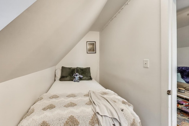 bedroom featuring vaulted ceiling