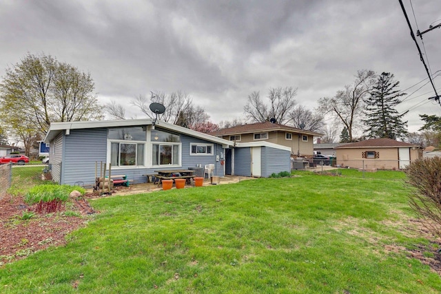 66W Jeffery Ave, Wheeling, IL 60090 - back of property with a yard, fence, an outbuilding, and a storage unit