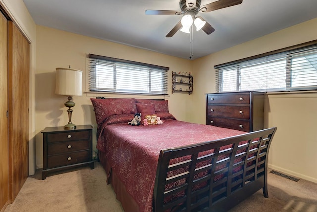 66W Jeffery Ave, Wheeling, IL 60090 - bedroom featuring a ceiling fan, visible vents, baseboards, a closet, and light carpet