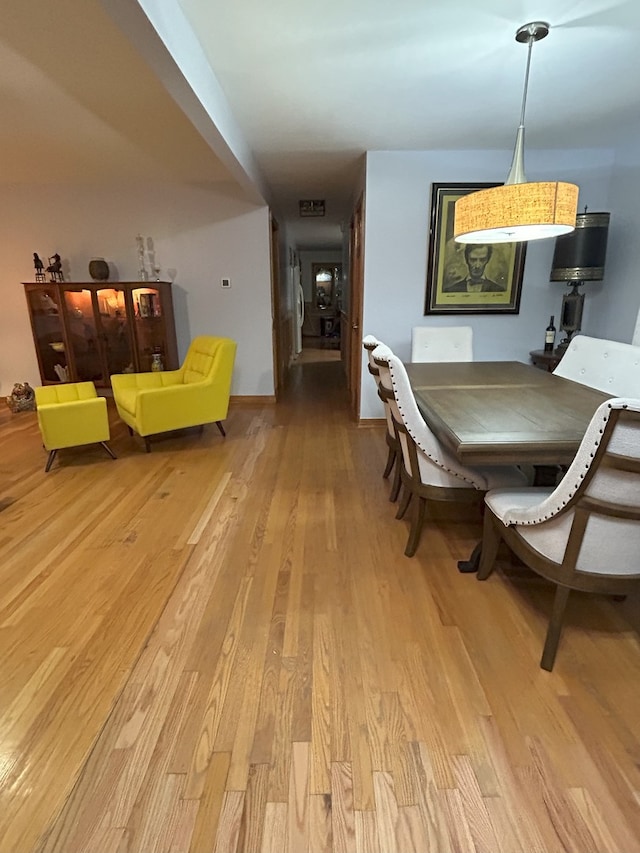 dining room with light wood finished floors