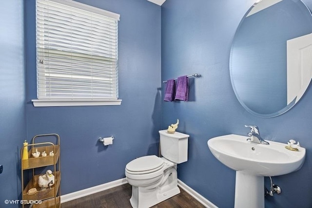 1683 Rockefeller Dr, Mundelein, IL 60060 - bathroom featuring wood finished floors, baseboards, toilet, and a sink