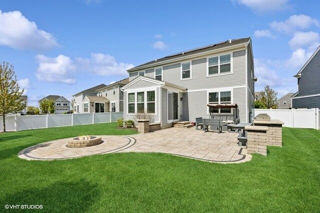 1683 Rockefeller Dr, Mundelein, IL 60060 - rear view of property featuring a fire pit, a patio, and exterior kitchen