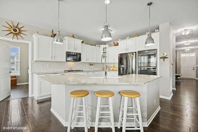 1683 Rockefeller Dr, Mundelein, IL 60060 - kitchen featuring stainless steel appliances, backsplash, white cabinetry, dark wood-style flooring, and baseboards