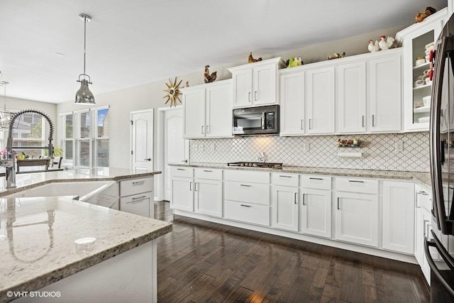 1683 Rockefeller Dr, Mundelein, IL 60060 - kitchen with a sink, white cabinetry, stainless steel gas stovetop, backsplash, and dark wood-type flooring