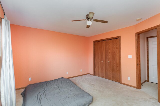 1918 Clement St, Crest Hill, IL 60403 - bedroom with baseboards, light colored carpet, ceiling fan, and a closet