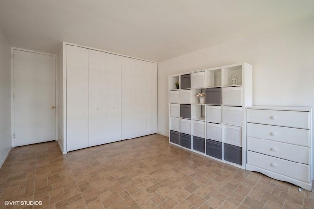 unfurnished bedroom with a closet