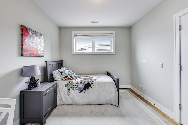 bedroom with visible vents and baseboards