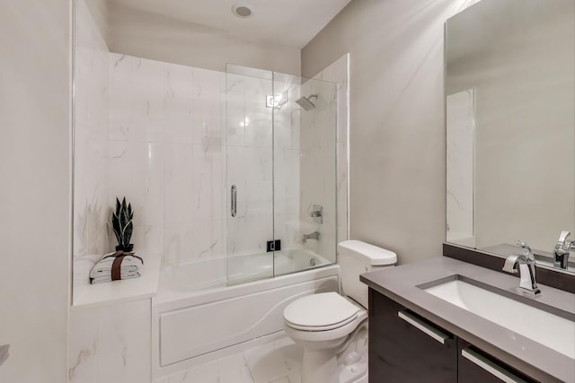 full bath featuring toilet, marble finish floor, vanity, and combined bath / shower with glass door