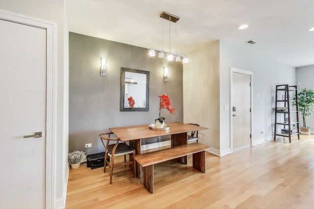 dining room featuring recessed lighting, baseboards, visible vents, and light wood-style floors