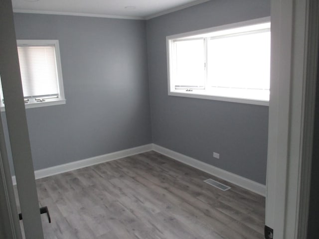 439 Indianwood Blvd, Park Forest, IL 60466 - empty room featuring crown molding, wood finished floors, and baseboards