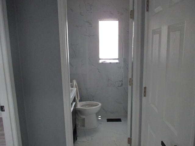 439 Indianwood Blvd, Park Forest, IL 60466 - bathroom with marble look tile flooring and toilet