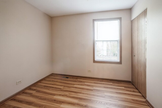1326 Narragansett Dr, Carol Stream, IL 60188 - unfurnished room featuring light wood-style floors and baseboards