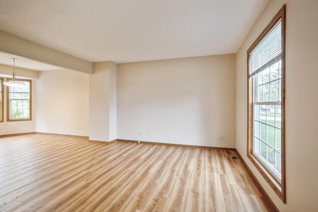 1326 Narragansett Dr, Carol Stream, IL 60188 - spare room featuring light wood-style flooring and baseboards