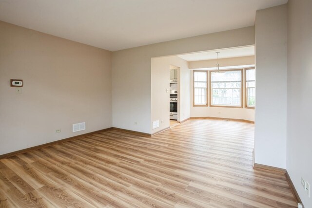 1326 Narragansett Dr, Carol Stream, IL 60188 - unfurnished room with light wood-style flooring and baseboards