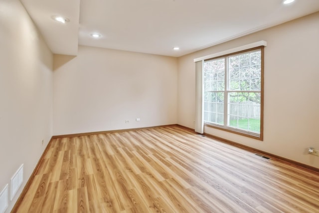 1326 Narragansett Dr, Carol Stream, IL 60188 - empty room featuring healthy amount of natural light, recessed lighting, light wood-style floors, and baseboards