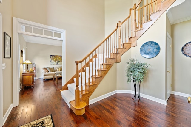 610 Wind Energy Pass, Batavia, IL 60510 - stairway with hardwood / wood-style floors, baseboards, ornamental molding, and a high ceiling
