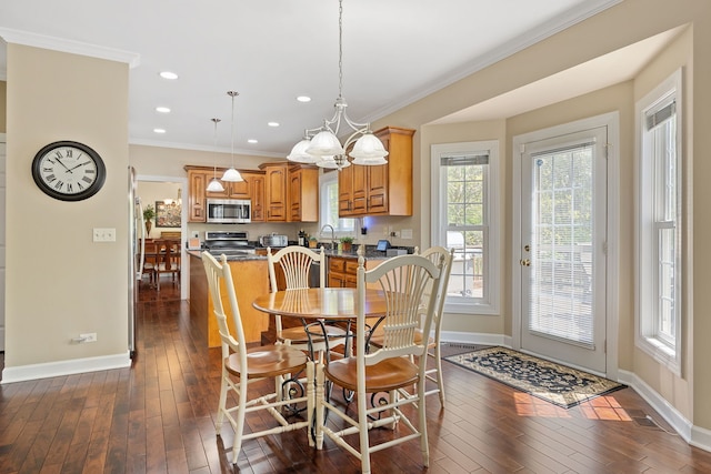 610 Wind Energy Pass, Batavia, IL 60510 - dining area with baseboards, dark wood-style flooring, crown molding, recessed lighting, and a chandelier
