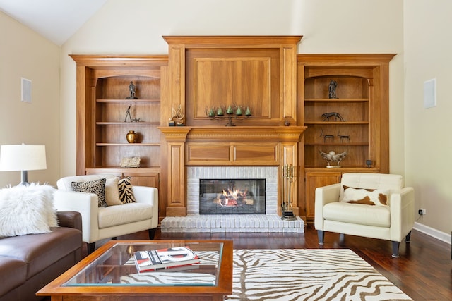 610 Wind Energy Pass, Batavia, IL 60510 - sitting room with dark wood-style floors, vaulted ceiling, a brick fireplace, and baseboards