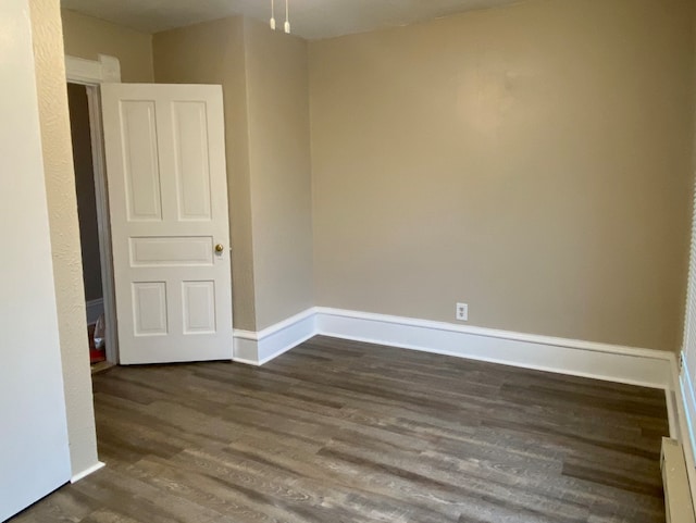 221 N Main St, Wilmington, IL 60481 - unfurnished room featuring dark wood-type flooring and baseboards