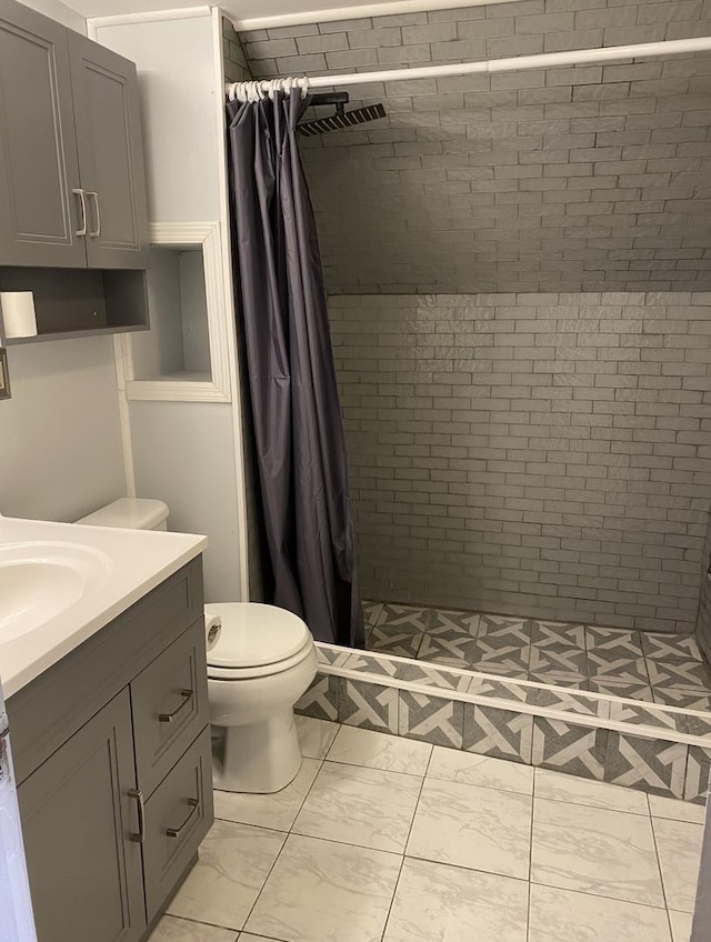 221 N Main St, Wilmington, IL 60481 - bathroom featuring vanity, toilet, visible vents, and a shower stall