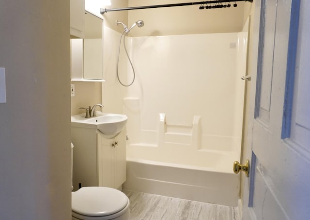221 N Main St, Wilmington, IL 60481 - full bath featuring toilet, wood finished floors, vanity, and shower / bathtub combination
