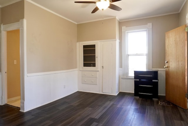221 N Main St, Wilmington, IL 60481 - spare room with dark wood-style floors, crown molding, and a ceiling fan