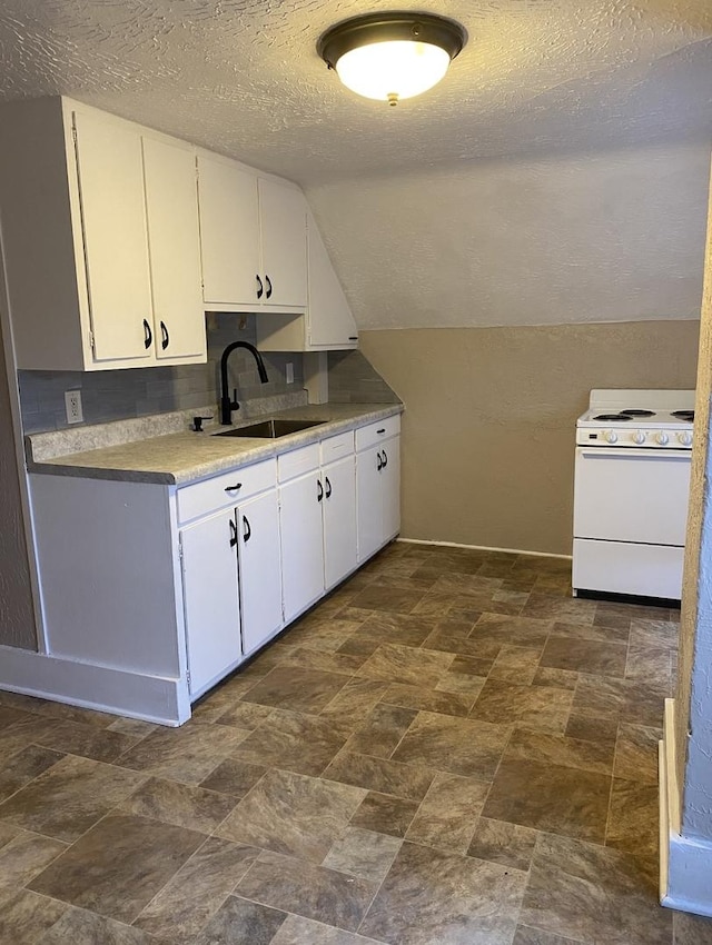 221 N Main St, Wilmington, IL 60481 - kitchen with a textured ceiling, white range with electric stovetop, white cabinets, and a sink