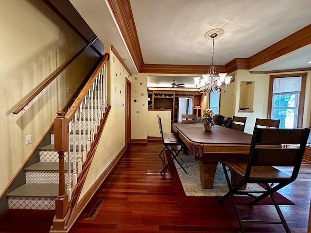dining room with stairway, a chandelier, baseboards, ornamental molding, and hardwood / wood-style flooring