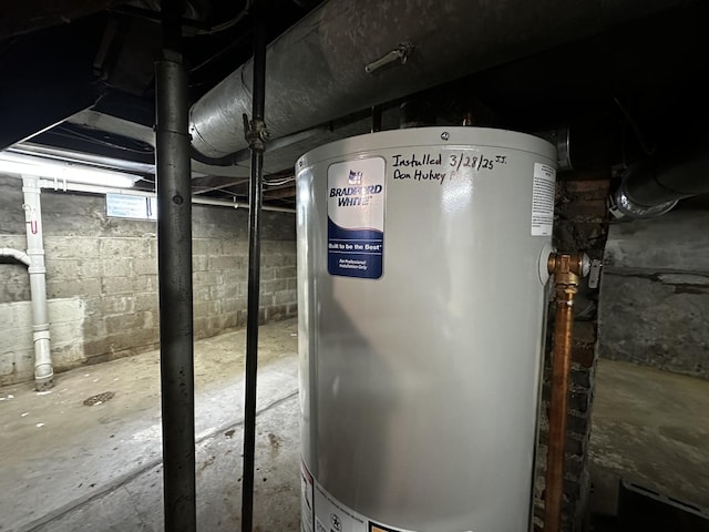 utility room with gas water heater