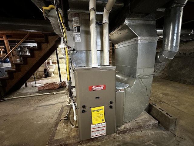 utility room featuring heating unit