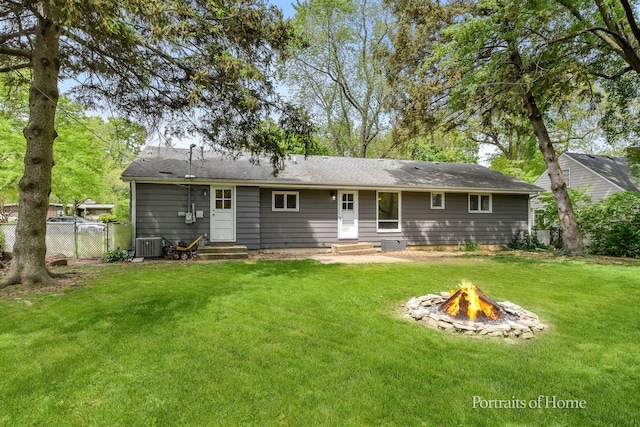232 S Randall Rd, Aurora, IL 60506 - rear view of house featuring entry steps, a fire pit, and central AC