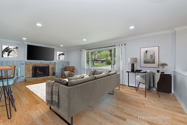 232 S Randall Rd, Aurora, IL 60506 - living area featuring ornamental molding, light wood-style floors, a fireplace, and recessed lighting