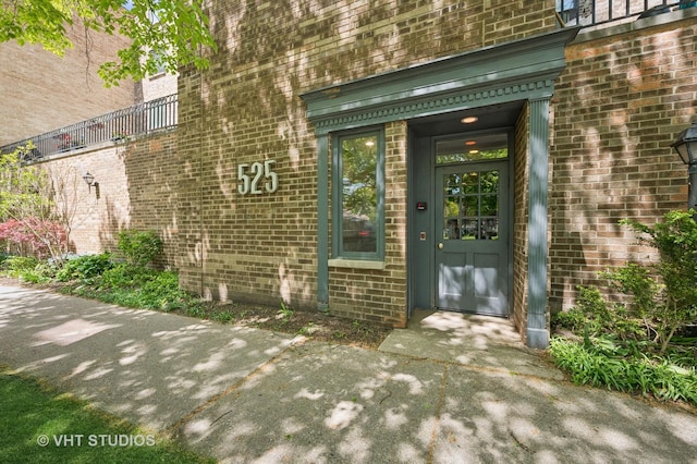 property entrance with brick siding