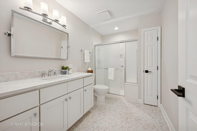 bathroom featuring a shower stall, vanity, toilet, and recessed lighting